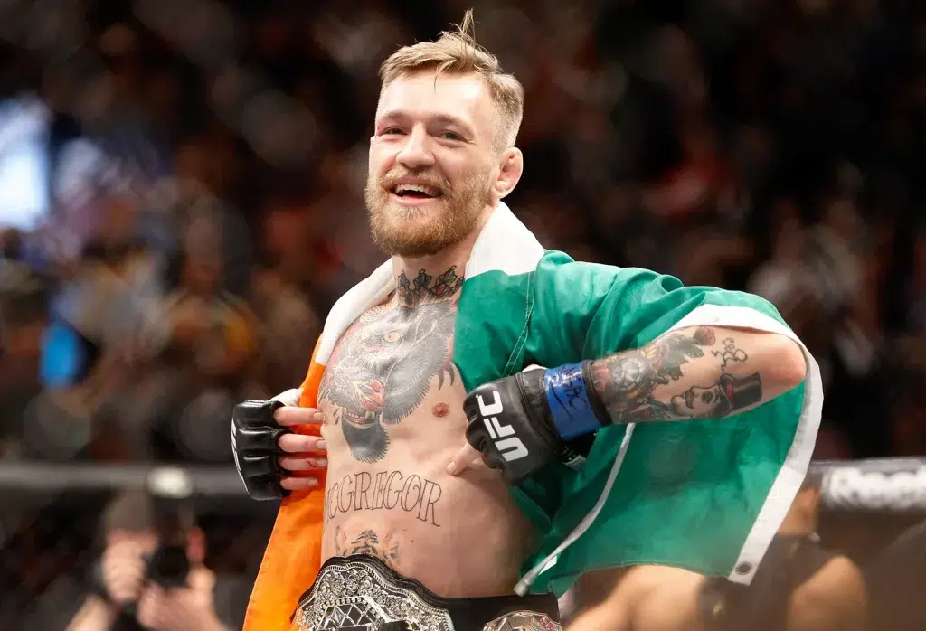 conor mcgregor celebrates first round knock out victory over jose aldo in featherweight title ufc 194 2015